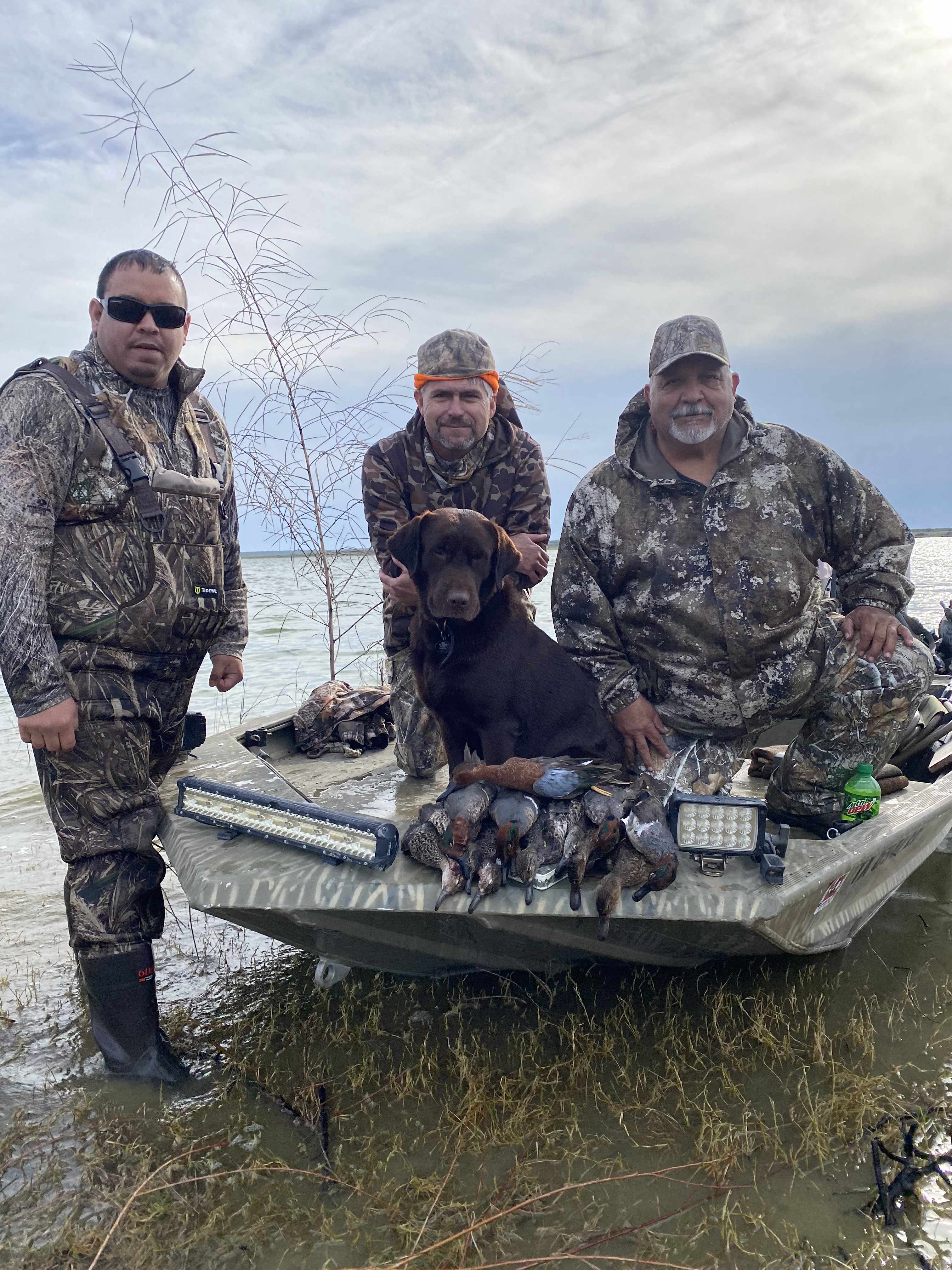 Retriever in the boat after a Starr County duck hunt